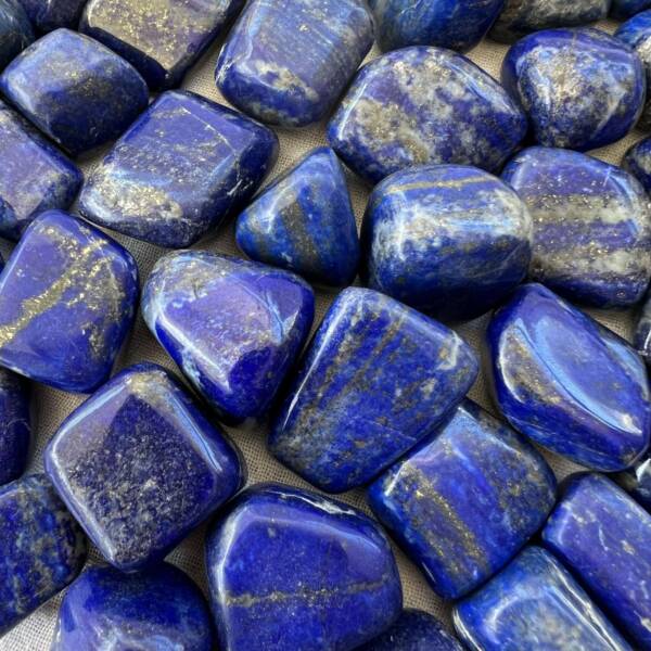 large royal blue lapis lazuli tumblestones natural mineral lazurite calcite iron pyrite (Na,Ca)8Al6Si6O24(S,SO)4