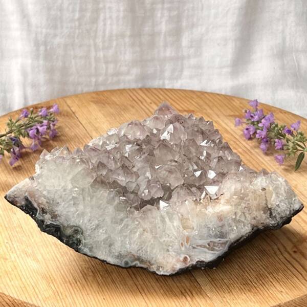 part polished pale lilac amethyst cluster on thin curved bedrock amethyst cluster natural purple quartz home decoration crystal sahasrara ajna crown third eye chakra online crystal shop Aotearoa natural healing