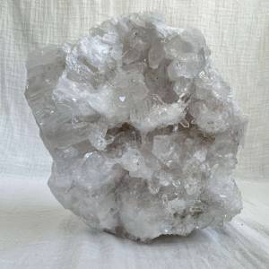 natural quartz cluster from Brazil with multidirectional points and drusy cavities