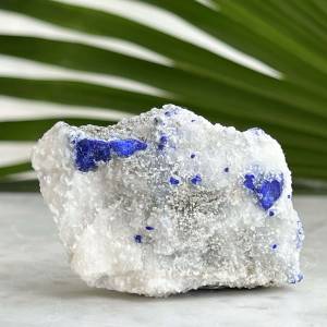 natural lapis lazuli on a white calcite bedrock