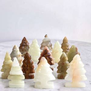 Calcite trees in a range of greens, browns and cream bands of natural mineral reminiscent of christmas trees