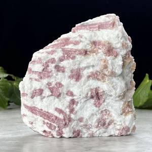large standing natural piece of pink tourmaline in a white bedrock