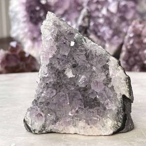 upright amethyst cluster with a natural curved bedrock