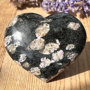 Luxullianite heart, polished smooth, black with pink inclusions
