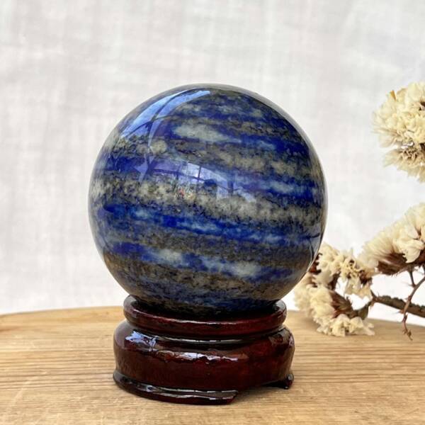 Lapis lazuli sphere with banding giving a planet like appearance