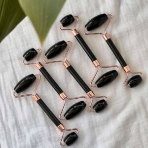 black obsidian massage roller set with 'rose gold'