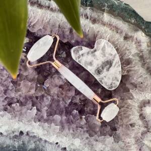clear quartz roller and gua sha in a white gift box