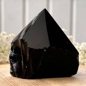 partly polished black obsidian