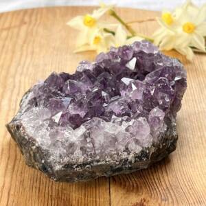 natural amethyst cluster on a dark bedrock