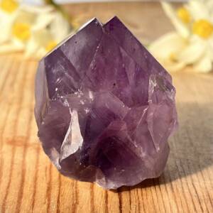 amethyst point with a cut base to stand upright