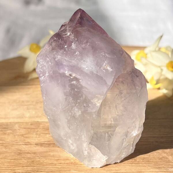 large amethyst point with a cut base so it stands upright