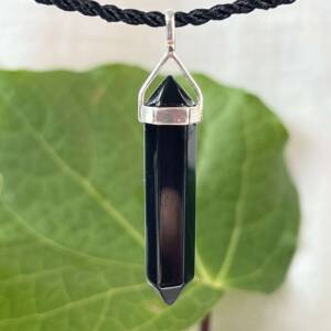 black obsidian pendant set in silver with six sides and double terminated