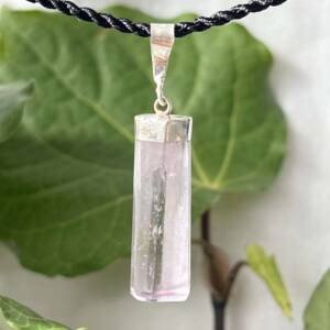 kunzite pendant shaped and polished set in silver