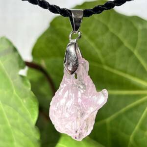 natural kunzite pendant, pale lilac, with metal clasp setting that swings