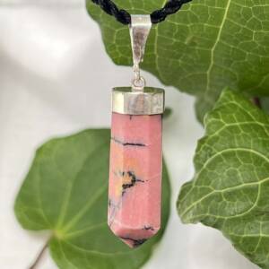 rhodonite pendant set in silver with eight sides and a four facet tip