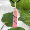 rhodonite pendant a naturally bright pink with black veins and set in silver