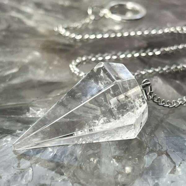 clear quartz pendulum with six sides and white metal chain