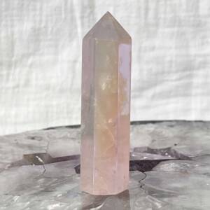 angel aura rose quartz tower with six sides and facets to create the tip