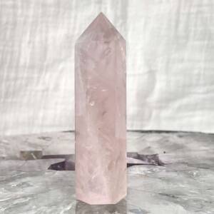 rose quartz tower, six sided with a faceted tip
