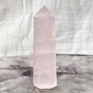 rose quartz tower with six sides cut and polished pink and translucent