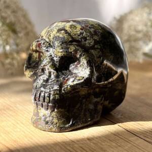 dragonstone skull carved and polished red piemontite and green epidote