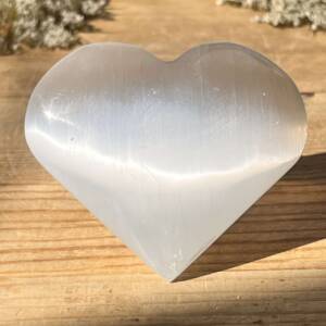 white selenite heart with a natural sheen