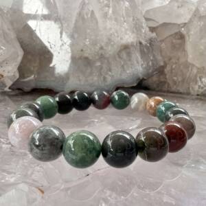 mixed agate bracelet with a range of green, brown, red and cream 10mm beads on green elastic