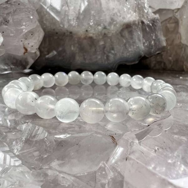 moonstone bracelet madde with 6 mm beads on a clear elastic