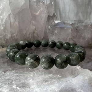 green agate bracelet made with 10 mm semi precious stone beads on a green elastic