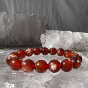 Red flower agate bracelet made with semi precious 10 mm beads on the double thread of elastic