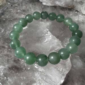 green aventurine bracelet made with 10 mm round beads on white elastic
