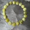 yellow jade bracelet made from a natural type of jade into 10 mm round beads