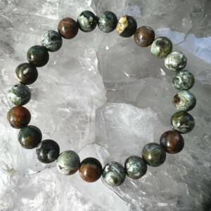 rhyolite bracelet with 8 mm beads of green, cream and warm brown mineral elements of this unusual quartz, feldspar and biotite rock