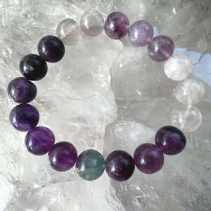 fluorite bracelet made with 10 mm spherical beads of lilac, purple and green natural fluorite colour
