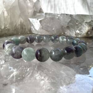 fluorite bracelet made with 8 mm green and purple round beads carved from this natural crystal