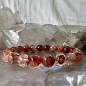 fire quartz bracelet with 8 mm round beads of bright orange hematite in clear natural quartz crystal