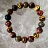 golden, red and blue tiger eye bracelet of round 10 mm beads, cut and polished quartz crystal