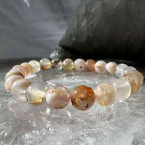 flower agate bracelet with a range of cream, white, pale yellow and orange agate 8 mm beads threaded on elastic
