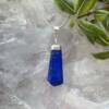 lapis lazuli pendant blue and golden rock of lazurite and iron pyrite with calcite set in silver