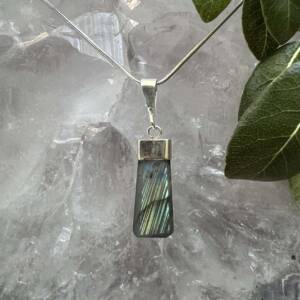 labradorite pendant set in silver natural crystal shaped and polished into attractive necklace