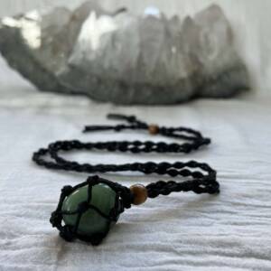 black macrame gem cage necklace with wooden bead