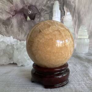 orange calcite sphere crystal ball wooden stand sold separately