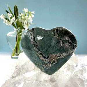 green serpentine heart on quartz crystal