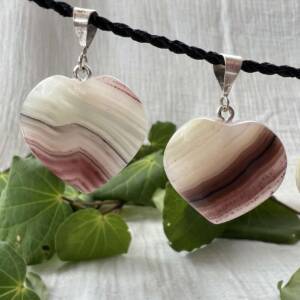 Heart shaped banded calcite pendants with a silver link suitable for any chain or cord