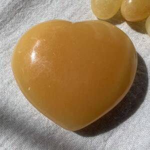 orange calcite heart vivid natural calcite shaped and polished meditation tool