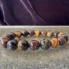 tiger eye bracelet red blue and golden tiger eye 10 mm beads quartz crystal on crocidolite