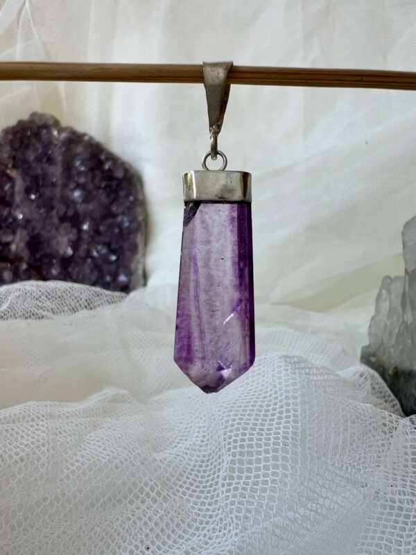 purple fluorite pendant with a silver plate cap and link