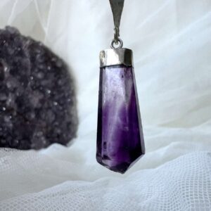 purple fluorite pendant with a silver plate cap and link