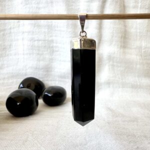 natural volcanic obsidian pendant black crystal necklace polished lava gems obsidian jewellery New Zealand online crystal shop SiO2 + MgO, Fe3O4 muladhara root chakra healing grounding crystal