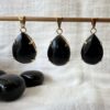 natural volcanic obsidian pendant black crystal necklace polished lava gems obsidian jewellery New Zealand online crystal shop SiO2 + MgO, Fe3O4 muladhara root chakra healing grounding crystal